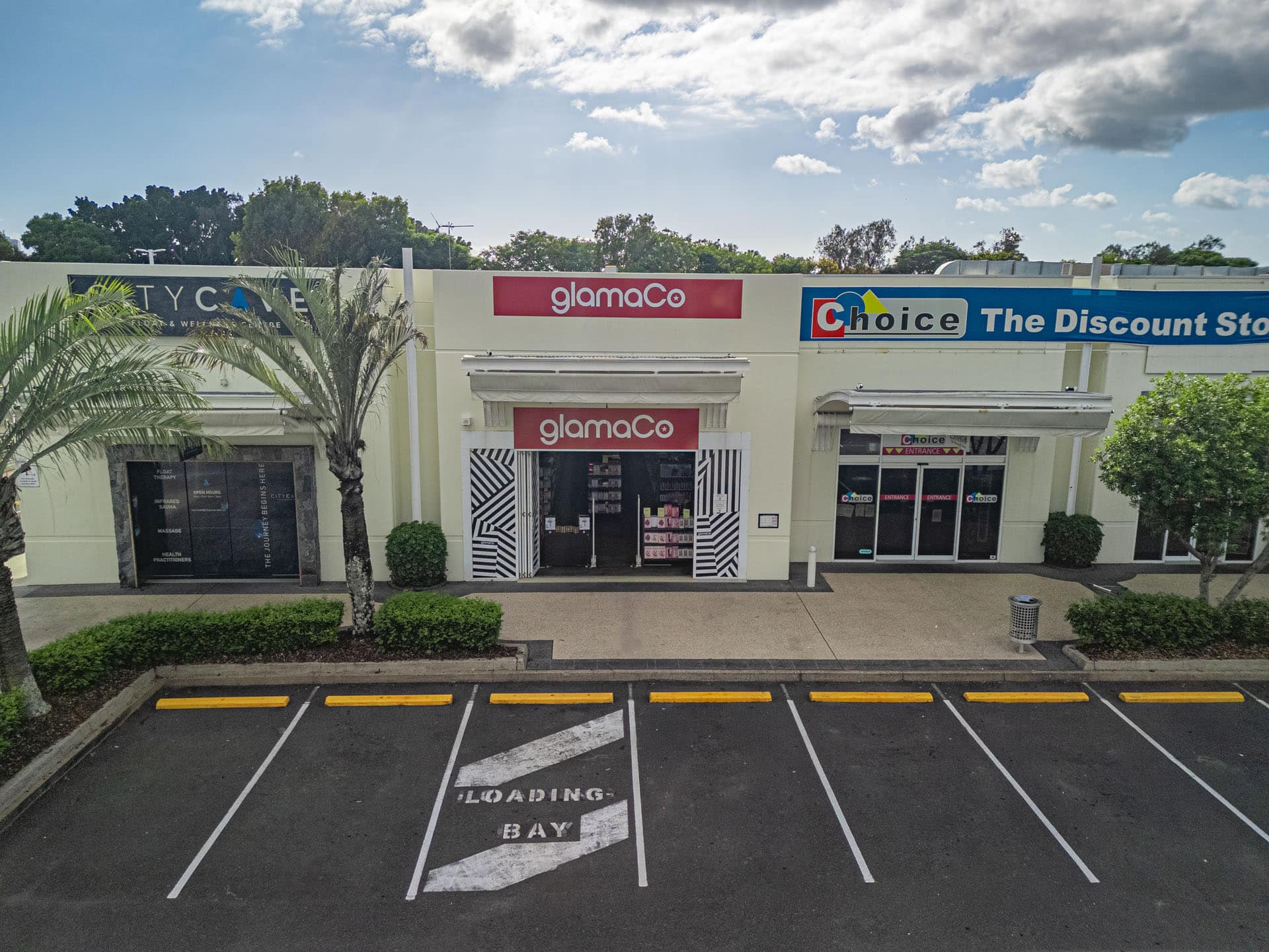 Front elevation of GlamaCo retail store entrance with parking area in Queensland.