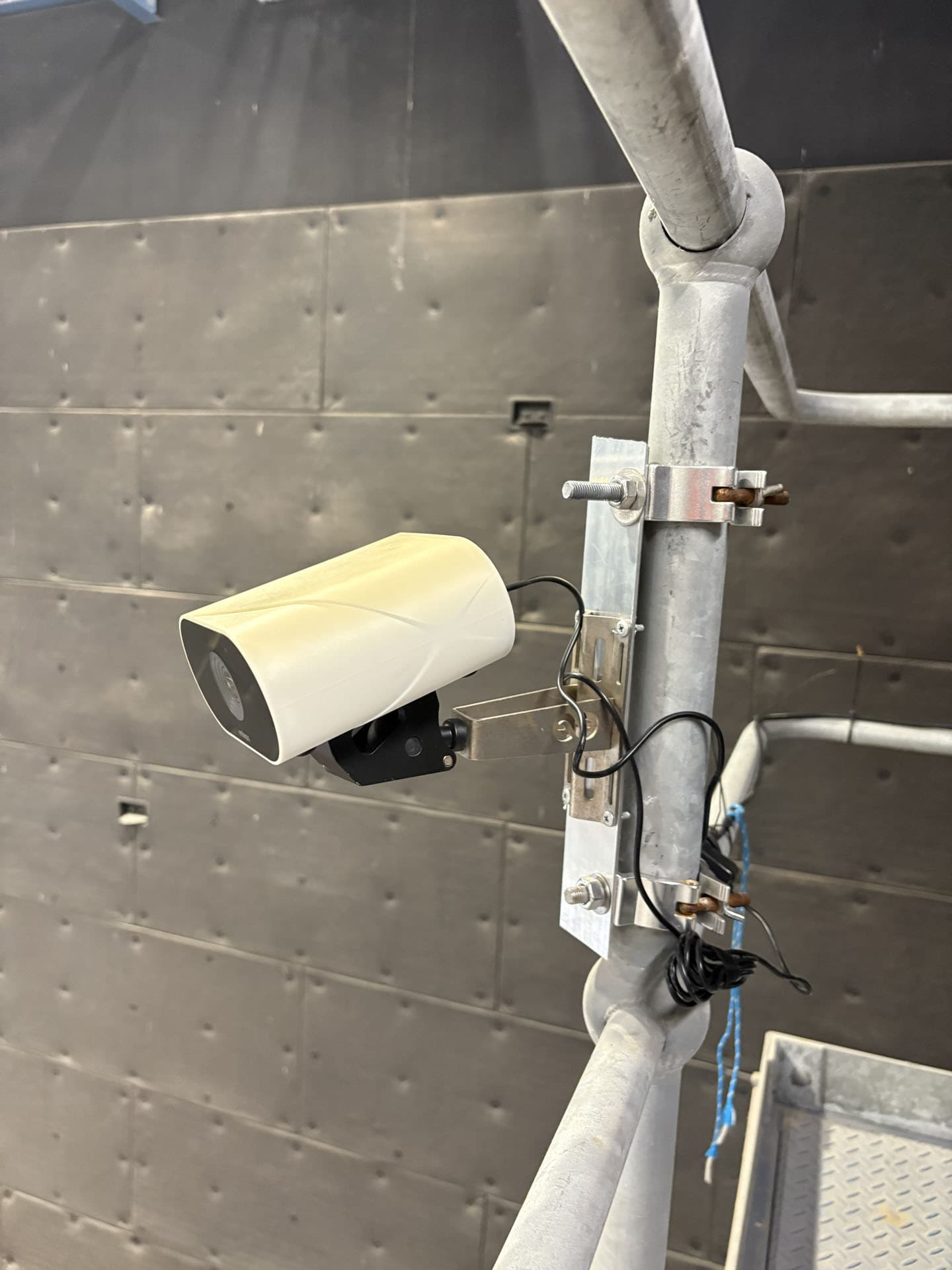 Wall mounted timelapse camera system secured for long term site recording
