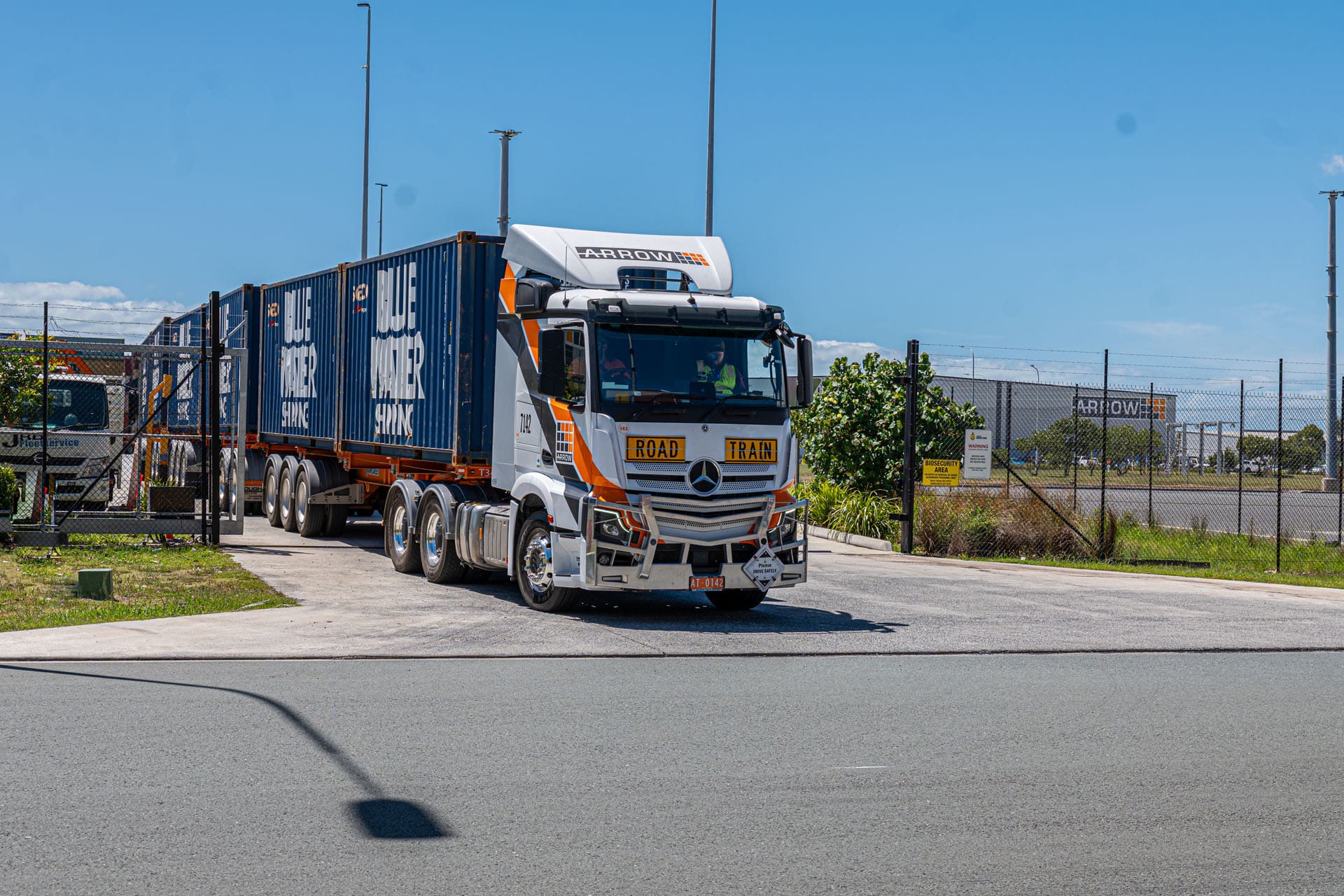Side view of Arrow Transport triple trailer configuration operating during compliance run in Queensland.