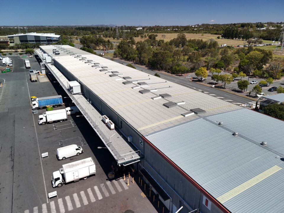 Drone roof inspections Brisbane – aerial overview of commercial warehouse rooftops at Brisbane Markets, Rocklea, photographed for Eatons